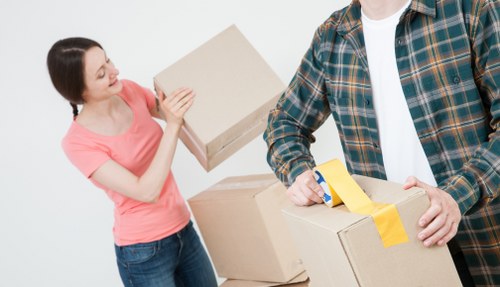 Packed moving boxes ready for a man and van service in Kew