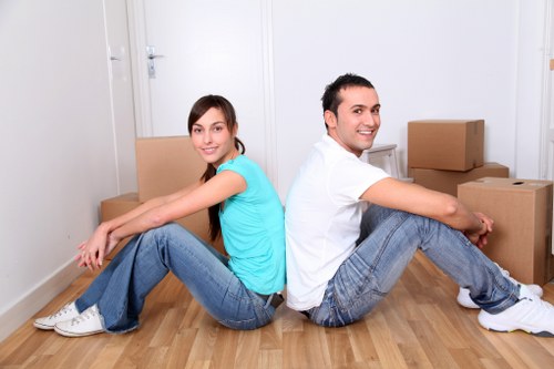 Organised office move preparation with files, furniture, and equipment arranged for transport